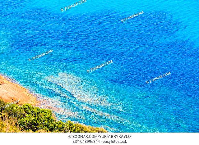 Summer sea scenery with aquamarine transparent water. View from shore (Sithonia, Halkidiki, Greece)