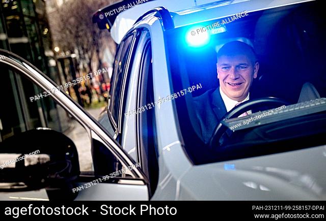 11 December 2023, Berlin: Kai Wegner (CDU), Berlin's governing mayor, sits in a networked police vehicle of the future at the opening of the ""Experience Center...