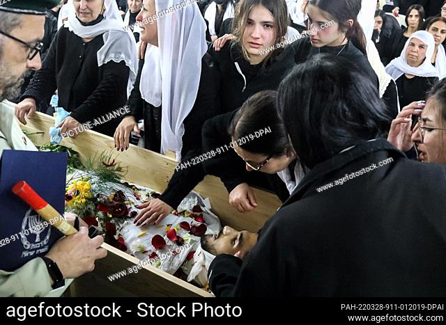 28 March 2022, Israel, Kisra-Sumei: Relatives mourn over the body of Israeli border policeman Yezen Falah, during his funeral at Kisra-Sumei village