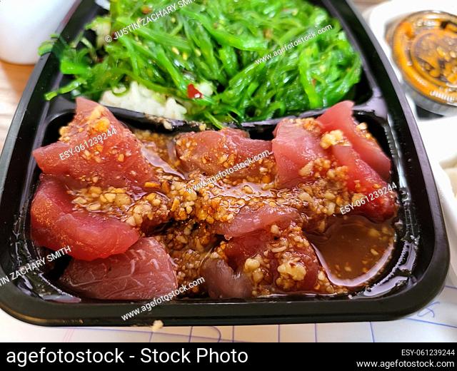 Hawaiian poke raw tuna fish with seaweed and rice
