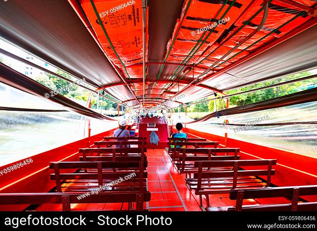 Bangkok, Thailand - April 21 2018: Boat travel in the canals of Bangkok on a hot sunny day
