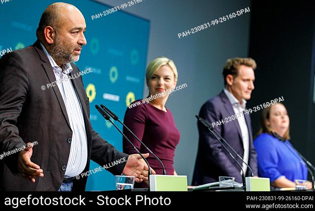 31 August 2023, Bavaria, Nuremberg: Omid Nouripour (l), federal chairman of Bündnis 90/Die Grünen, speaks alongside Katharina Schulze (2nd from left) and Ludwig...