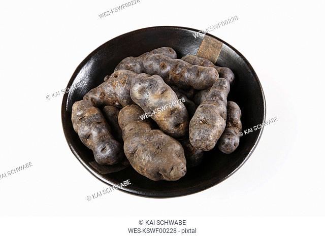 Truffle de Chine blue-violet potatoes in bowl, elevated view