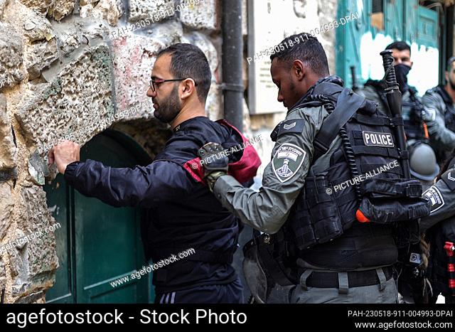 18 May 2023, ---, Jerusalem: An Israeli security officer checks a man in Jerusalem Old City ahead of Jerusalem Day, an annual event during which Israeli...