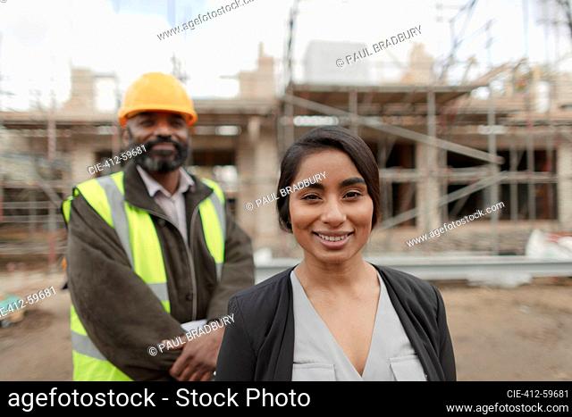 Portrait confident engineer and forewoman at construction site