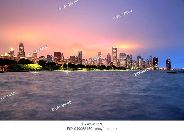Chicago, Illinois, USA - June 22, 2018 - The Chicago skyline at night after a storm across Lake Michigan