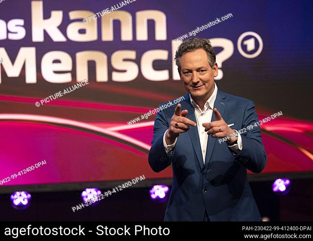 22 April 2023, North Rhine-Westphalia, Cologne: The presenter Eckart von Hirschhausen stands in the TV studio before the recording of the ARD show ""Was kann...