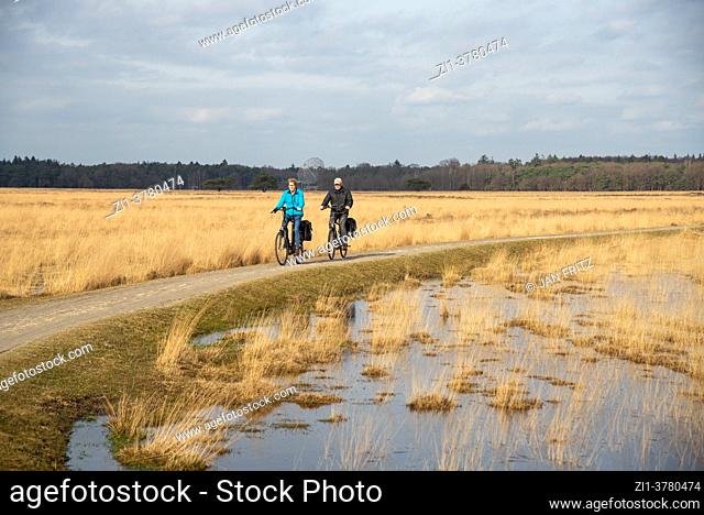 cyclists at Dwingelderveld in Drente, Holland