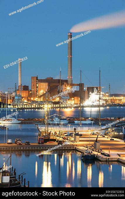 Helsinki, Finland. Evening Night View Of Industrial Zone Of Power Plant. Night Illuminations Lighting, Blue Hour