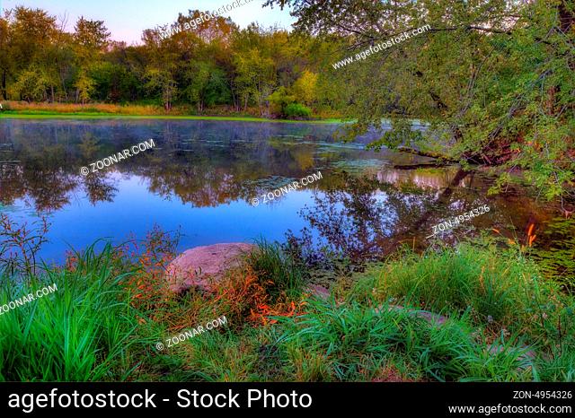 An HDR landscape of a forest and pond