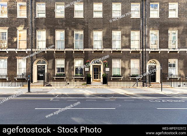 UK, London, Brick buildings in empty street during curfew in Bloomsbury neighbourhood