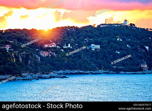 Cap Ferrat peninsula sunset view from Villefranche sur Mer, amazing scenery of French riviera, Alpes Maritimes department of France