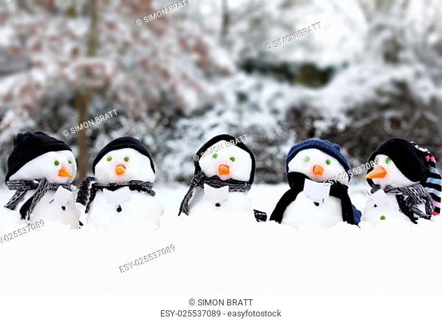 Winter snowman scene with snow and trees