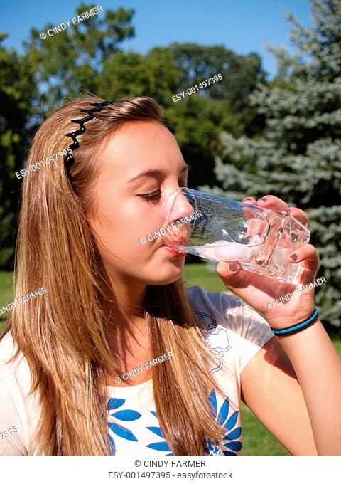 teen girl drinking water