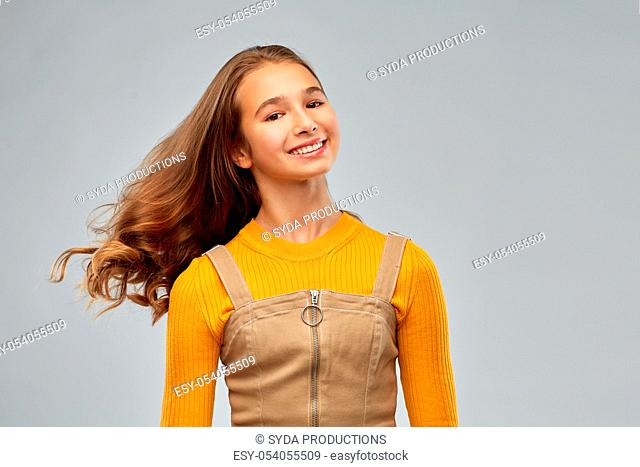 young teenage girl with waving long hair
