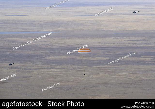 The Soyuz MS-19 spacecraft is seen as it lands in a remote area near the town of Zhezkazgan, Kazakhstan with Expedition 66 crew members Mark Vande Hei of NASA