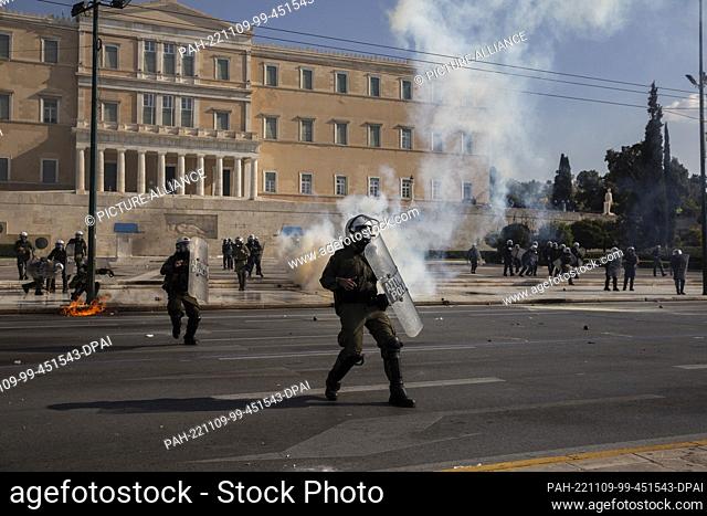 09 November 2022, Greece, Athen: Riot police during clashes with protesters at a 24-hour general strike in Athens. Major Greek trade unions have called for a...