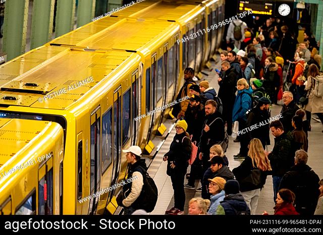 16 November 2023, Berlin: People wait for the subway at Alexanderplatz during the warning strike at Deutsche Bahn. The German Train Drivers' Union (GDL) had...