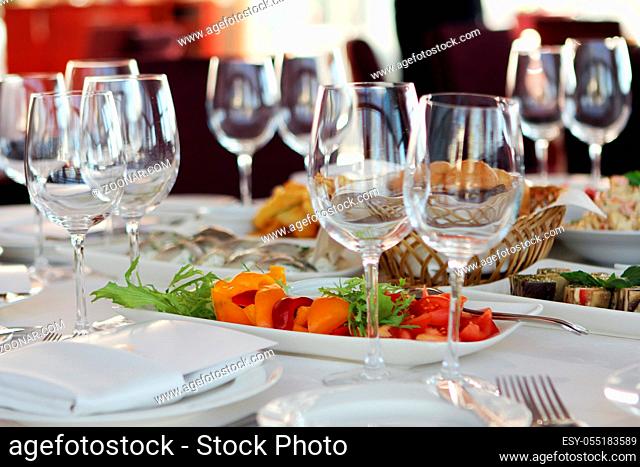 Banquet table in restaurant with different snacks