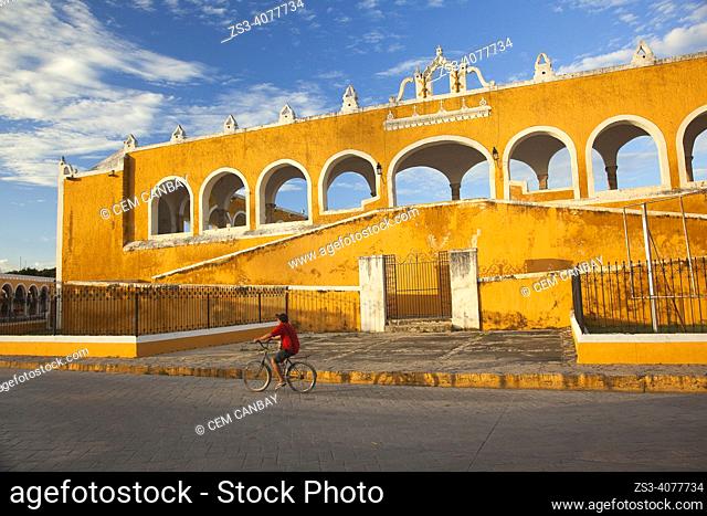 Cyclist in front of the Monastery-Convent Of San Antonio De Padua, Izamal, Yucatan Province, Mexico, North America