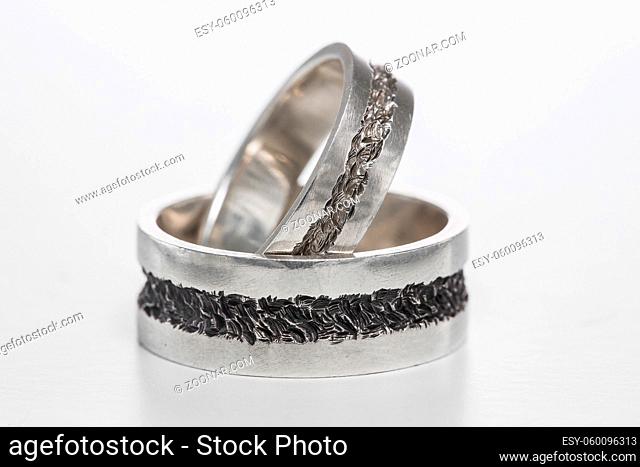 Two wedding rings on a white background. Mr. and Mrs