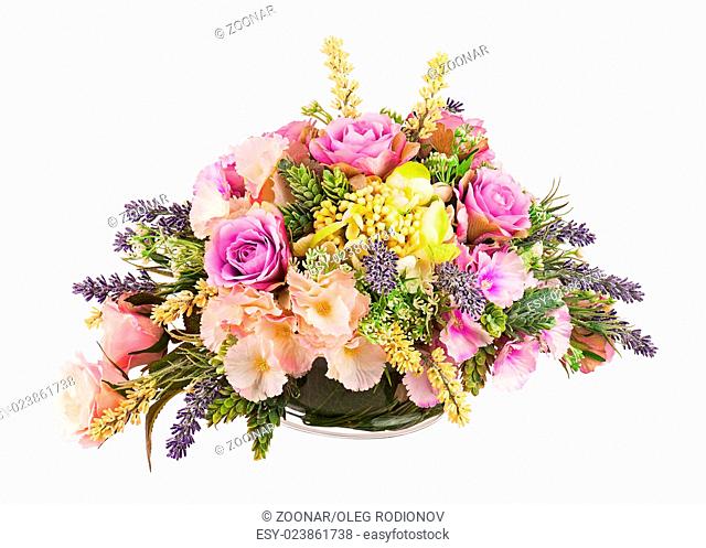 Bouquet from artificial flowers arrangement centerpiece in vase