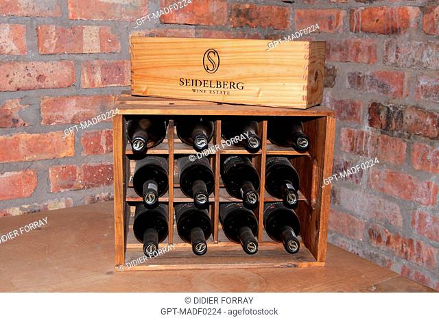 A CASE OF BOTTLES OF WINE IN A CELLAR AT THE SEIDELBERG VINEYARDS, PAARL, THE WINE ROAD, WESTERN CAPE PROVINCE, SOUTH AFRICA