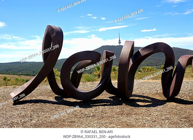 CANBERRA - MAR 01 2019: The monumental public art, Wide Brown Land, an outdoor sculpture against Telstra tower at the National Arboretum in Canberra Australian...