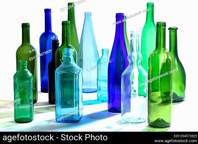 group of bottles scattered on a white background