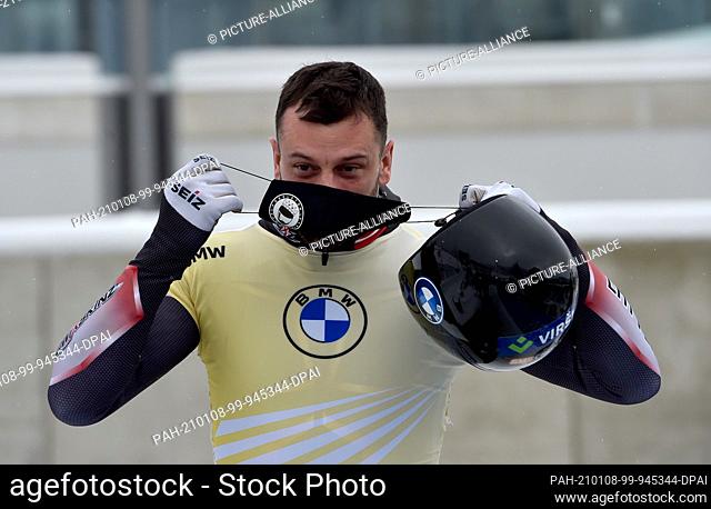 08 January 2021, North Rhine-Westphalia, Winterberg: Skeleton: World Cup men, 2nd run: Martins Dukurs from Latvia is happy about his second place