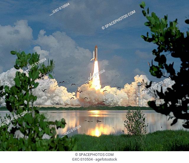 07/13/1995 --- Startled birds scatter as the stillness of a summer morning is broken by a giant's roar. The Space Shuttle Discovery thundered into space from...