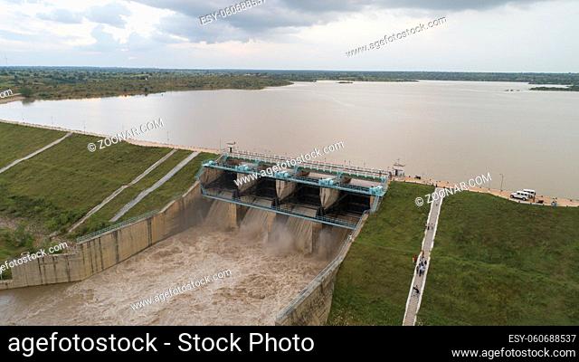 Aerial bird eye of water reservoir flood gates open to release water during monsoon flood from dam at raichur, India