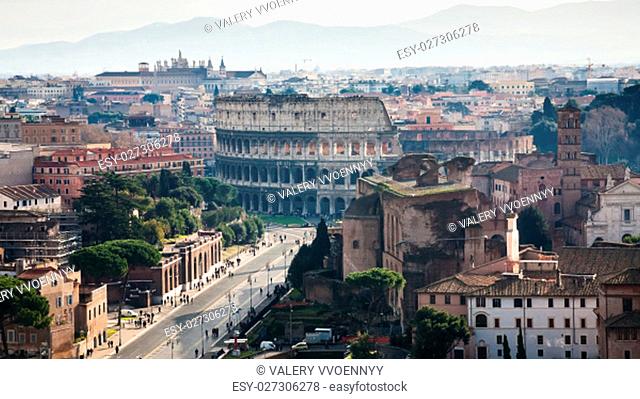 Travel to Italy - above view of Via dei Fori Imperiali and Coliseum from Capitoline Hill in Rome city in winter