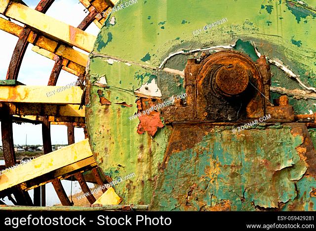 A boat rusts in the boatyard long ago abandoned
