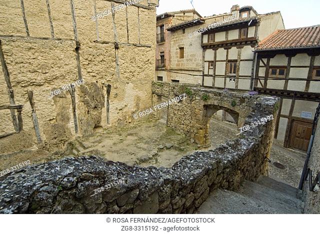 Street and ruin of ancient building with a stone arch, village of Frias, Las Merindades, province of Burgos, Spain