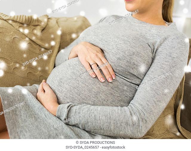 close up of pregnant woman with big belly