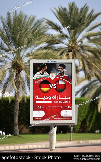 14 November 2022, Oman, Maskat: An advertising display indicating the friendly match between the German national soccer team and the national team of Oman can...