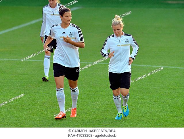 Germany's Dzsenifer Marozsan (L) and Svenja Huth take part in the final training session during the UEFA Women's Euro at Vaxjo Arena in Vaxjo,  Sweden