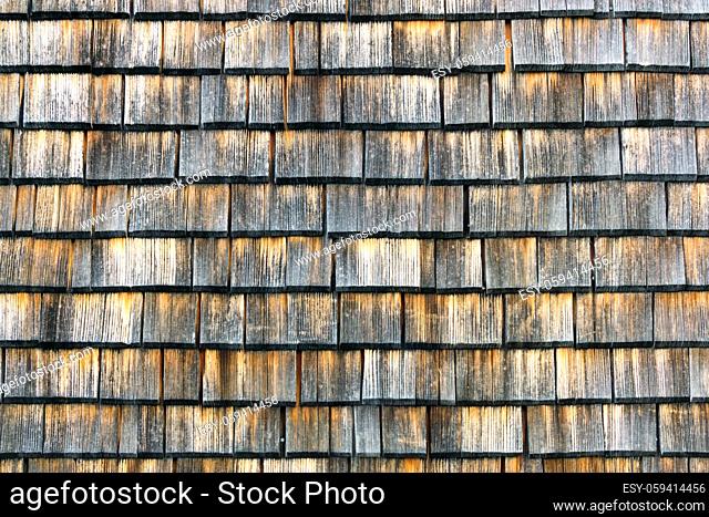 Shingle aged wooden wall roof background with copyspace, Weathered shakes with nice colored texture
