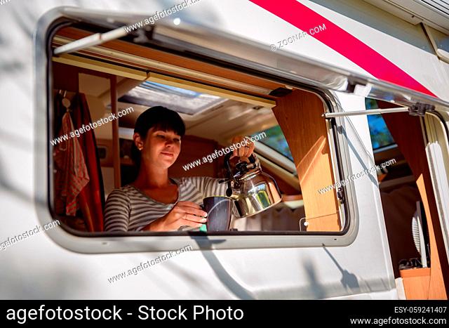 Woman cooking in camper, motorhome interior VR. Family vacation travel, holiday trip in motorhome, Caravan car Vacation