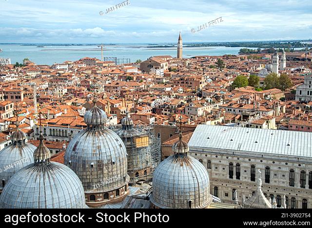 view at the city with domes of basilica and San Francesco della Vigna church from campanile tower at San Marco square in Venice, Italy