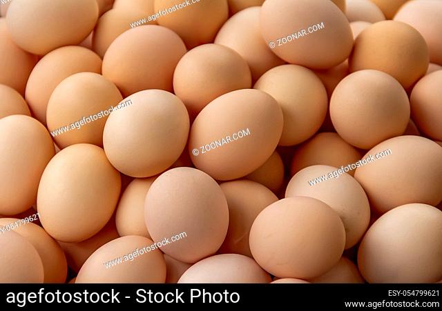 full frame background showing lots of brown eggs