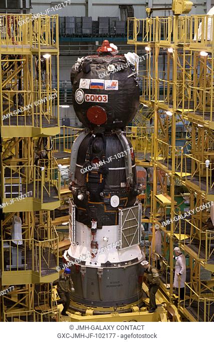 At the Integration Facility at the Baikonur Cosmodrome in Kazakhstan, the Soyuz TMA-08M spacecraft stands ready to be moved into place March 22 for its...