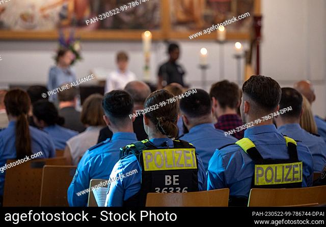 22 May 2023, Berlin: Police officers sit in a service in the Martin Luther Church. The Protestant School Neukölln celebrates a thanksgiving service for all...