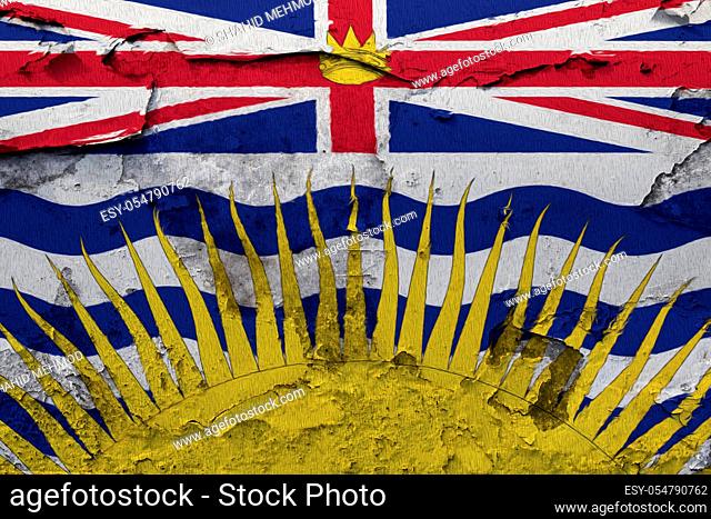 British Columbia flag painted on the cracked grunge concrete wall