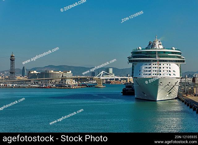 BARCELONA, SPAIN - OCTOBER 10, 2017: City of Barcelona and cruise ship docking in port of Barcelona in Spain