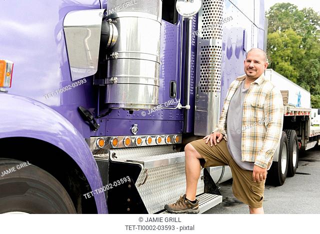 Truck driver and purple semi-truck