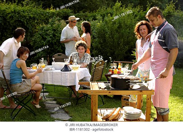 People having a barbecue in the garden