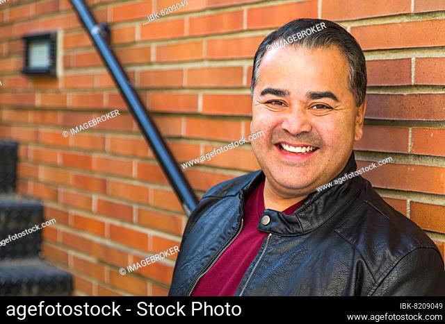 Headshot portrait of handsom hispanic man