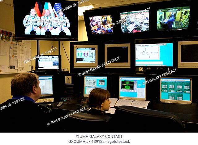 At the Gagarin Cosmonaut Training Center in Star City, Russia, training instructors look over a bank of monitors May 6 as they conduct the first of two days of...